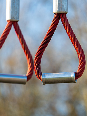 Close up of rope handles for an outdoor obstacle course for playgrounds.